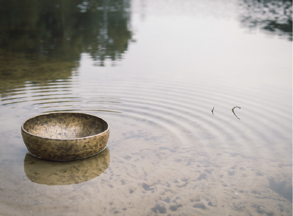 Singing bowl in water